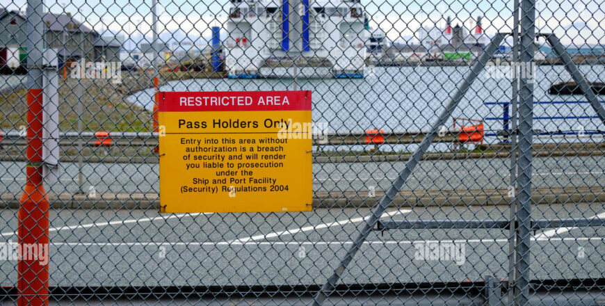 restricted-area-sign-with-ferry-in-background-at-the-holyhead-port-in-northern-wales-2A28Y0B.jpg